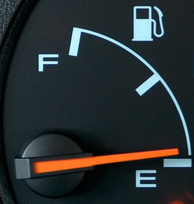 a close - up image of the fuel level gauge on the dashboard