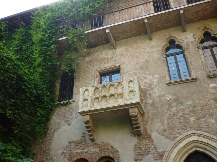 an old building with many windows and shutters