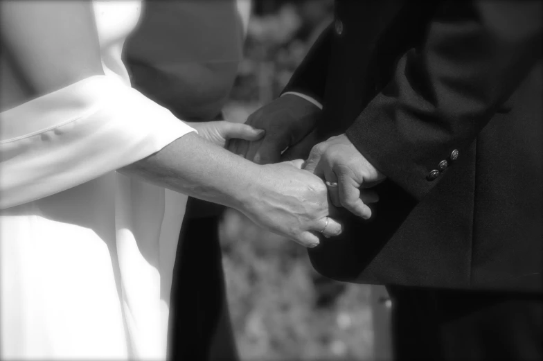 a close up s of people holding hands