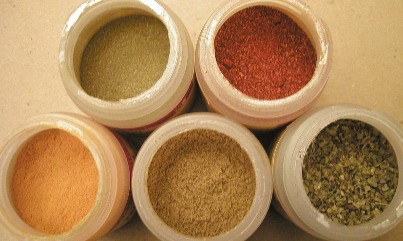 six different spices arranged in separate bowls