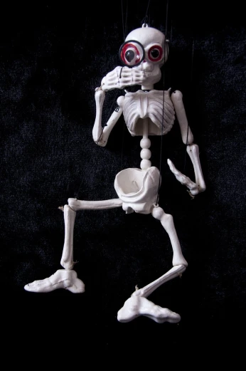 an action figure made up of bones and skeleton feet
