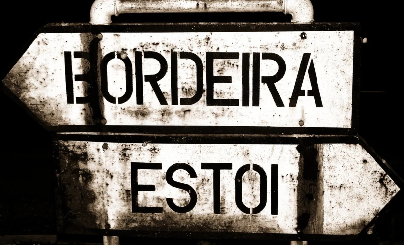 a sepia toned po of an old street sign