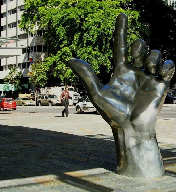 a hand is shown in the middle of the street