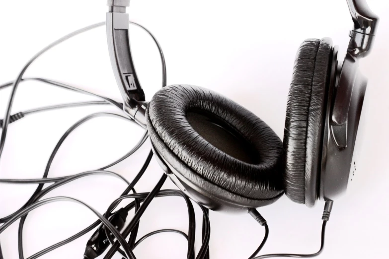 an assortment of headphones on a white background
