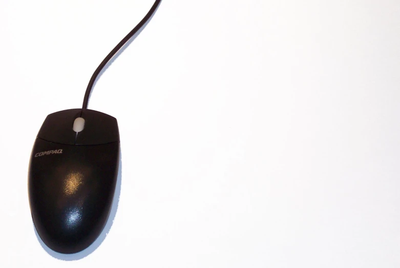 a computer mouse attached to the back of the mouse shell