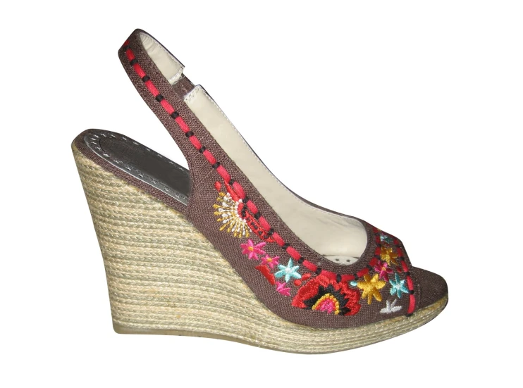 a pair of women's wedged shoes with embroidered flowers