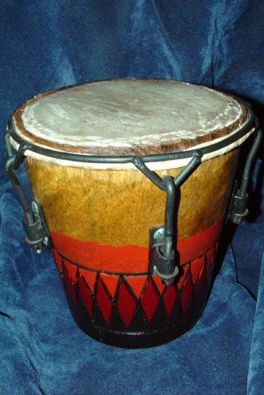 a large drum is sitting on a blue blanket
