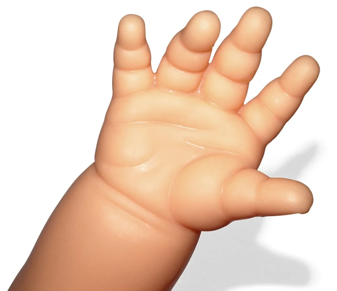 a hand holding up an object with two fingers