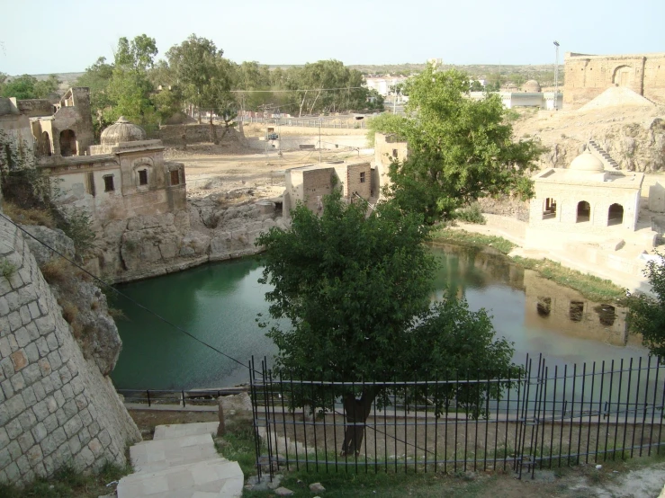 a pond with stairs leading up to it