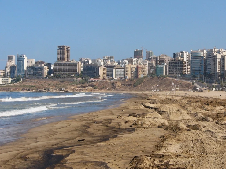 the ocean is surrounded by very high rise buildings