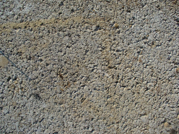 a closeup of cement, some small and others small