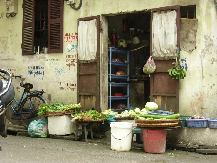 an outside scene with two pots and two bins