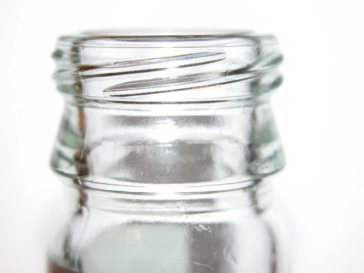 a jar filled with liquid on top of a table