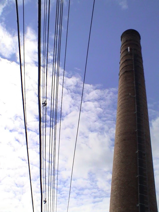 a tall building with power lines beside it