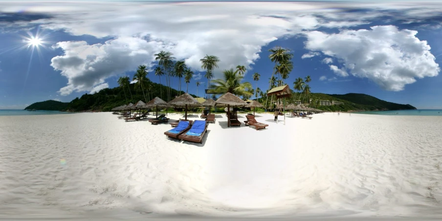 a panorama of beach chairs, thatched umbrellas and trees