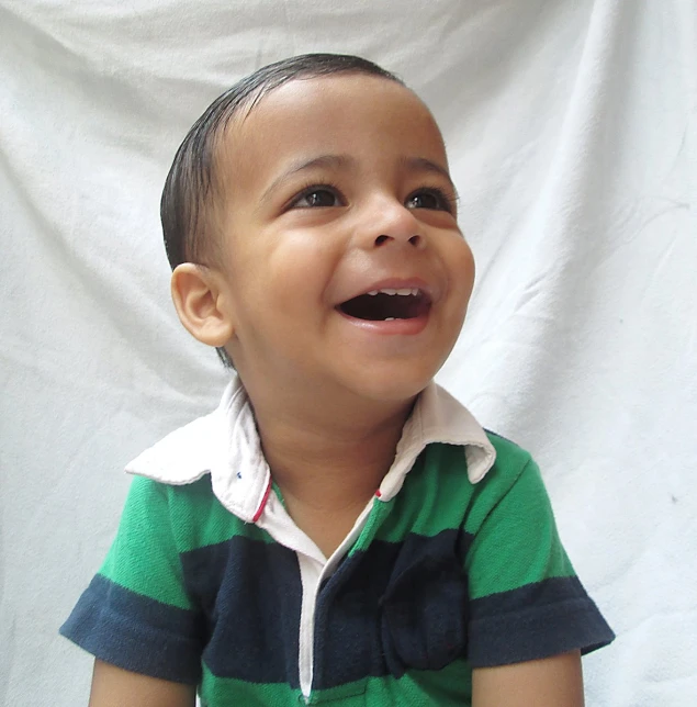  smiling for camera with white curtain