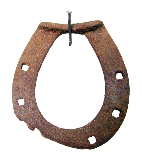 an old ring shaped steel object that appears to be in the form of an oval