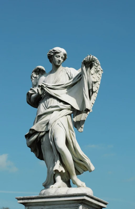 an image of a statue holding an angel