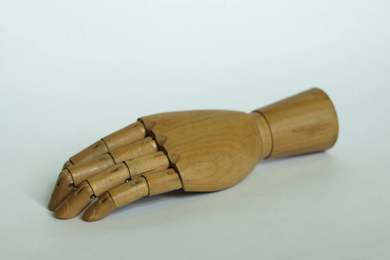 a wooden object that looks like a hand