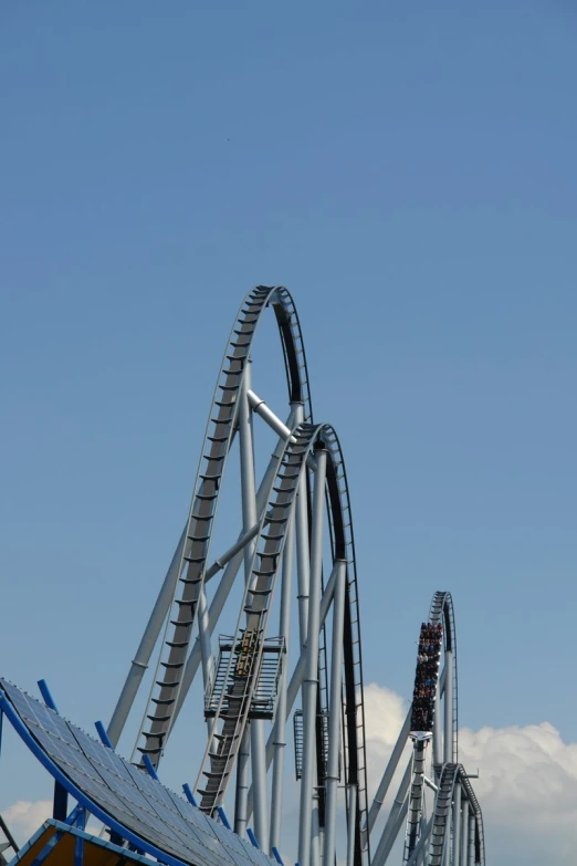 a roller coaster being hed by a jet liner