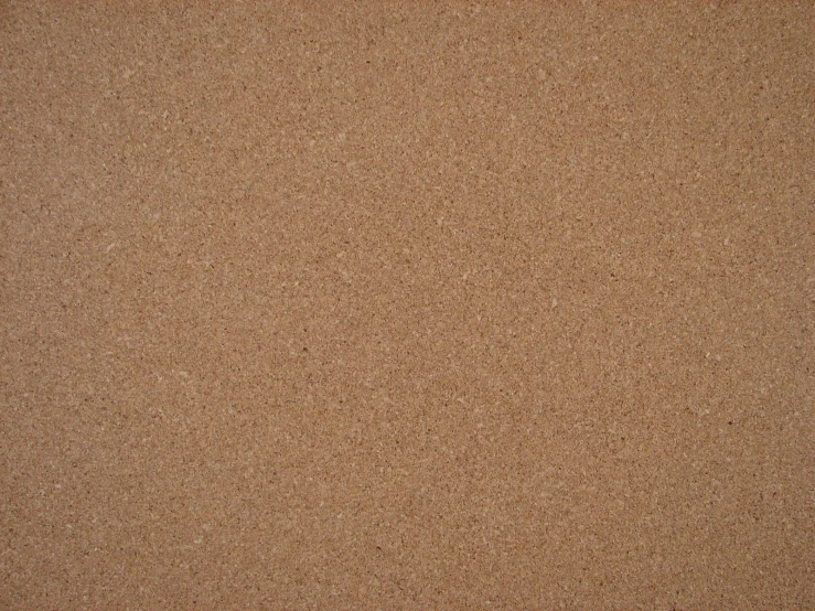 an image of a beige background with several tiny dots