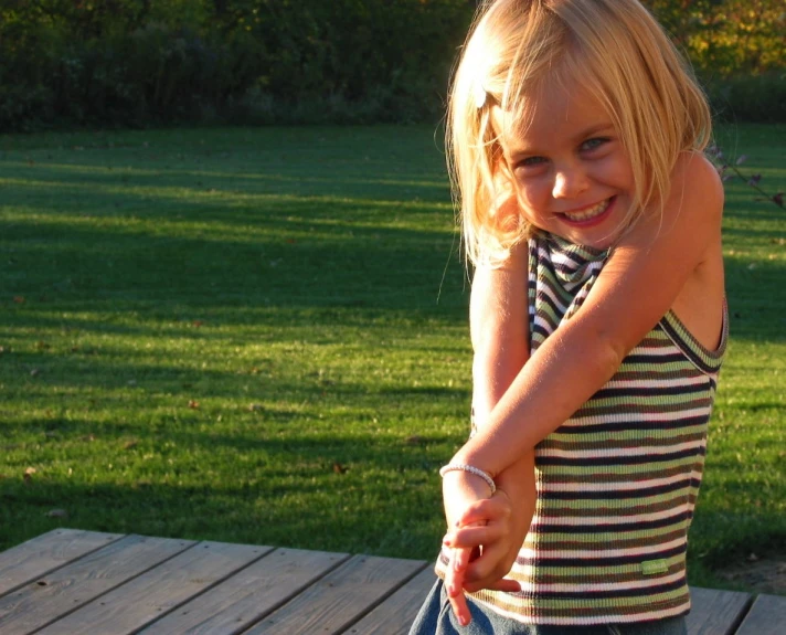 a  holding onto the hand of a frisbee