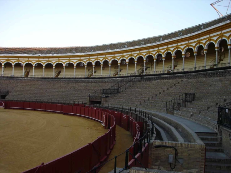 an empty arena with bull rings inside of it