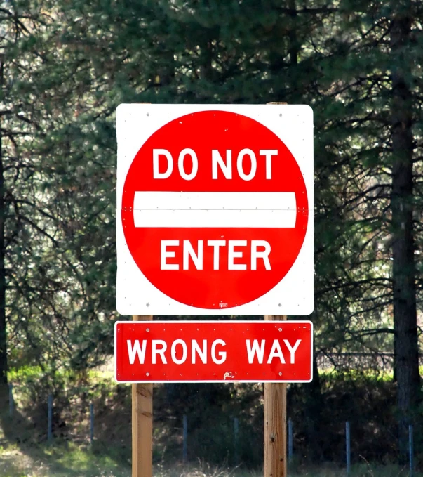 a do not enter sign and wrong way signs