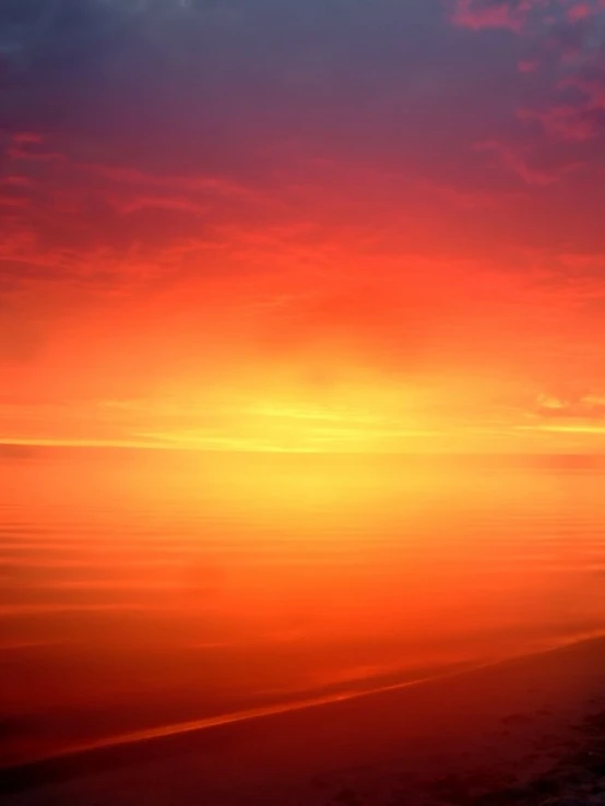 a bright orange and pink sunset with very few clouds