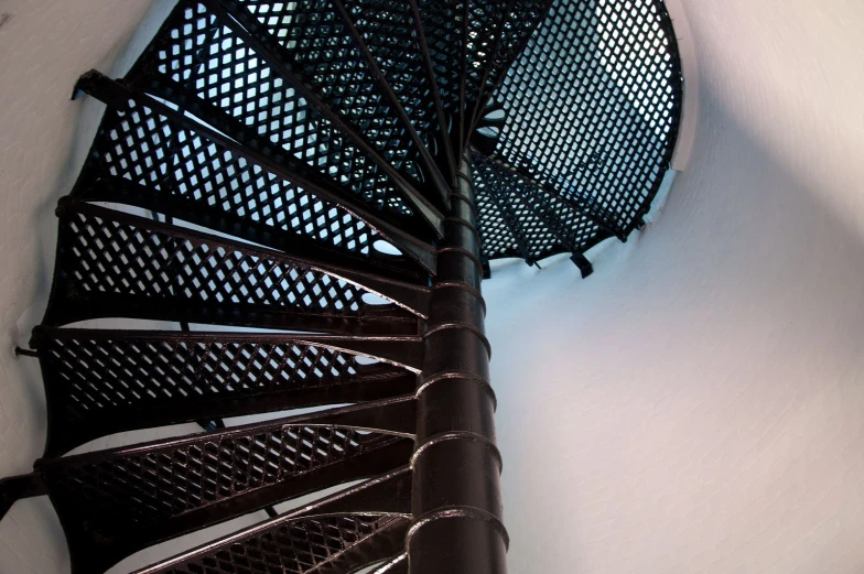 a spiral staircase design with metallic details