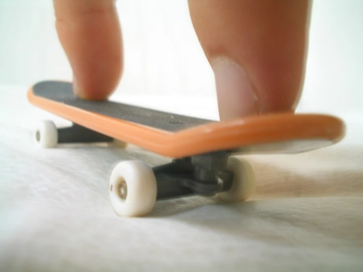 an image of a miniature skateboard with wheels