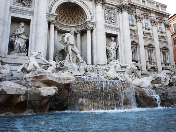 this is an image of some fountains in front of a building