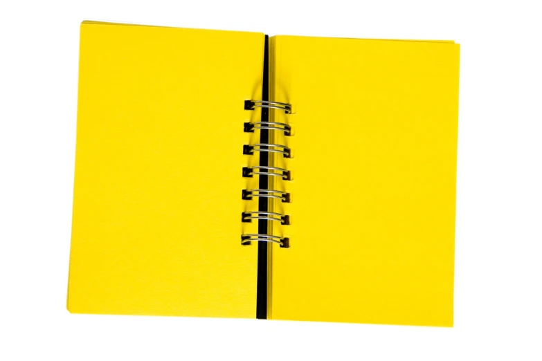 a yellow book on a white background