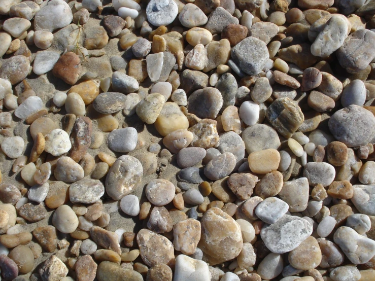 several rocks and gravel in a rock beach