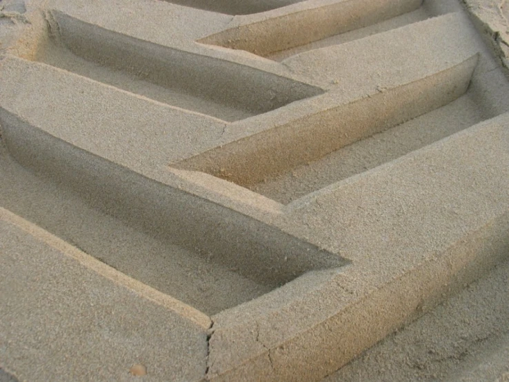 three rows of sand at the beach