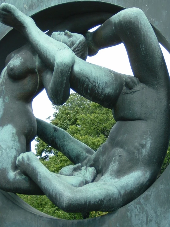 a statue shows an infant laying on the belly