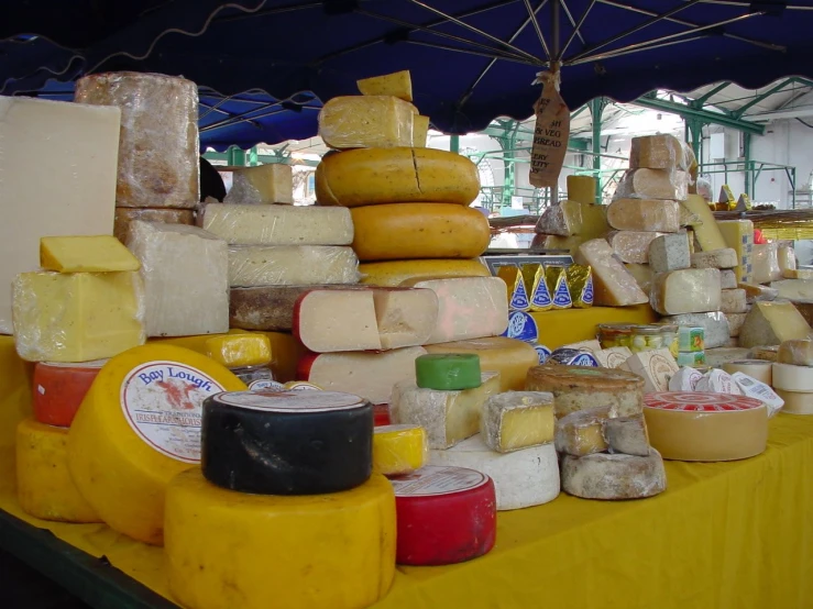 many different types of cheese are on the table