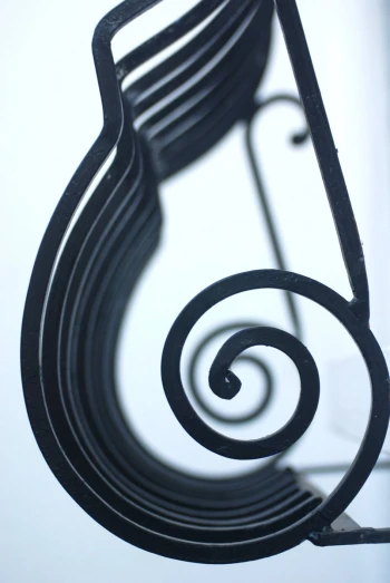 a metal object with spiral designs on it