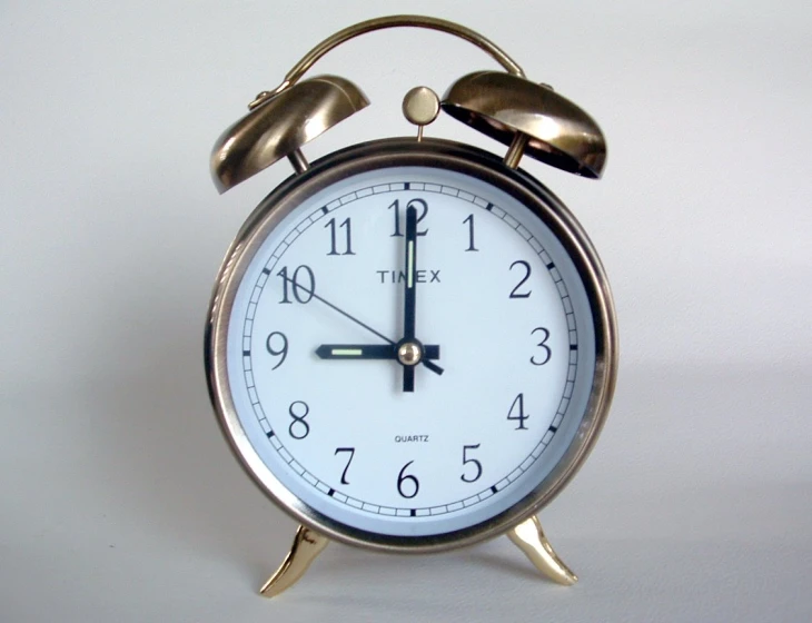 a clock that is on the ground with hands