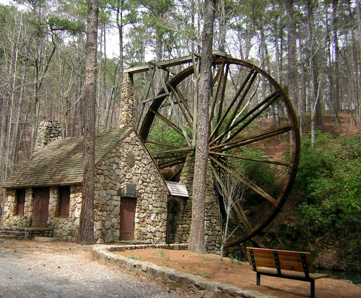 a old brick and stone building in the woods