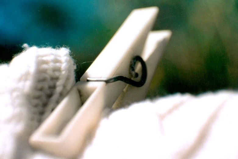 a close up view of two handles on a white knitted object