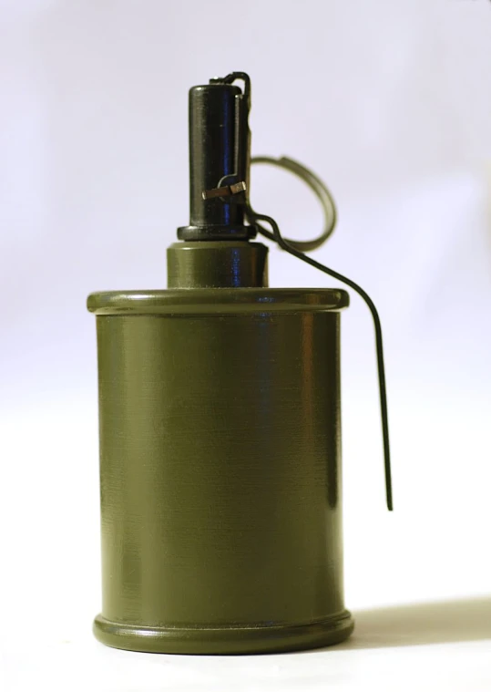 an army green bottle with metal cap