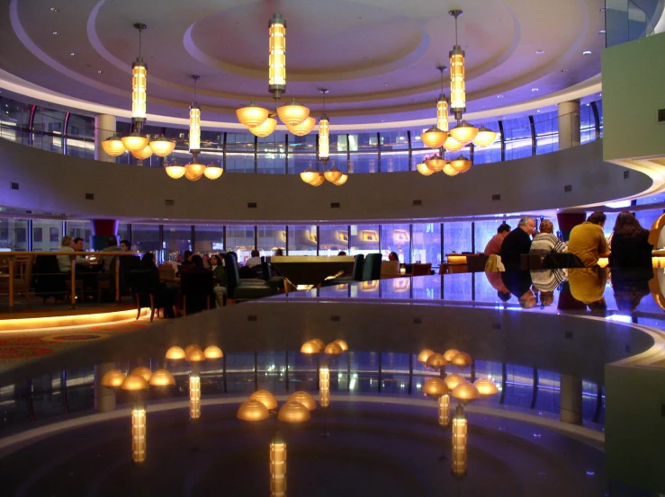 a modern lobby is illuminated with round lights