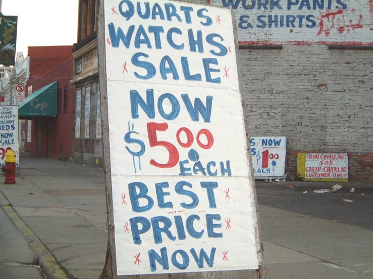 a sign advertising a new watch sale is displayed