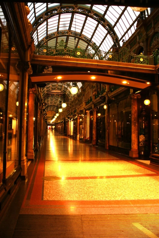 a hallway with a wall that is illuminated by bright light