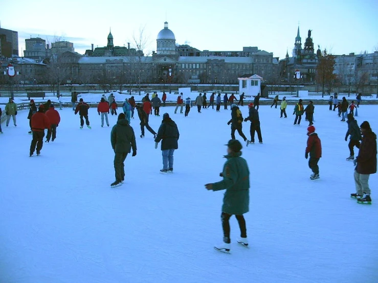 people are on the snow covered ground enjoying a day