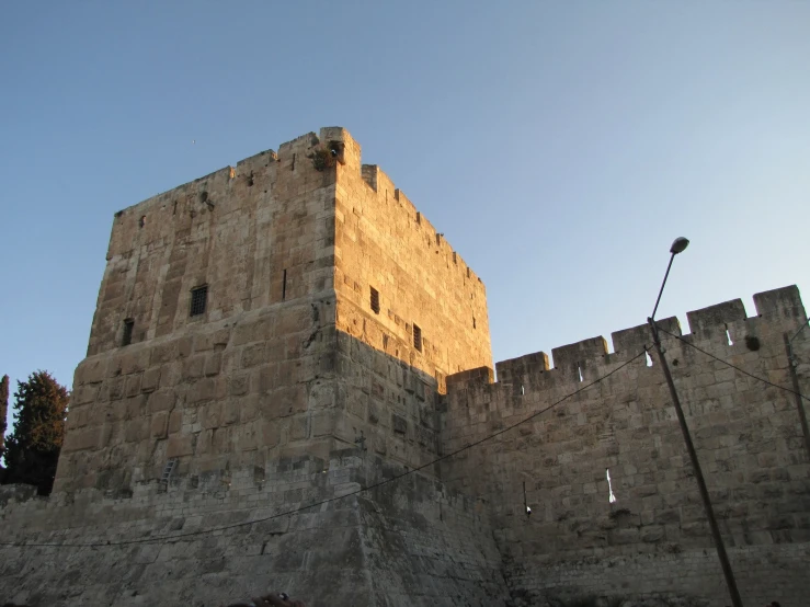 a castle wall with many windows on top