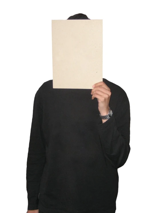 a person wearing a hoody holding up a paper