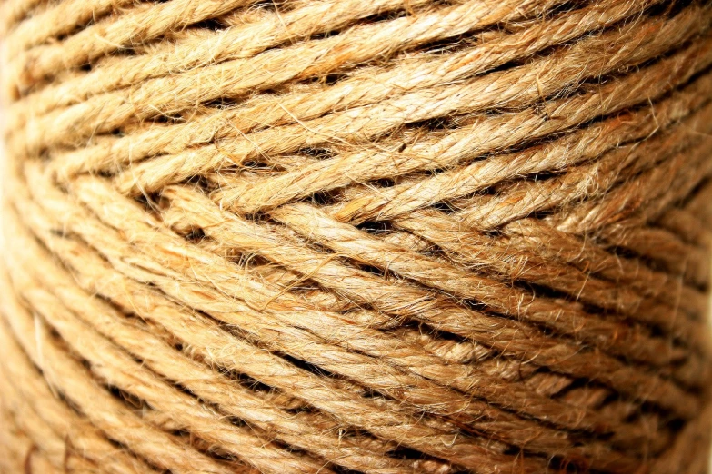 a close up view of a roll of natural yarn