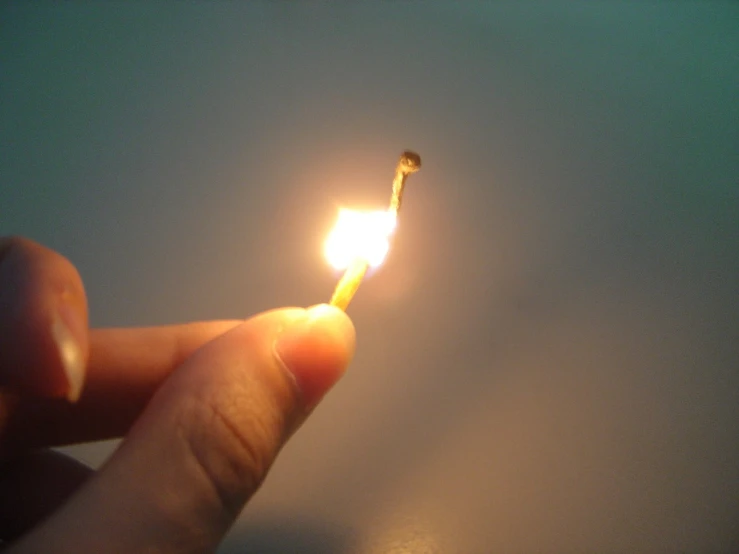 a lighter is being lit with light